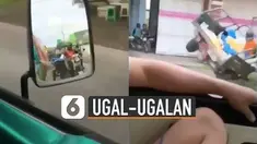 Mengendarai motor ugal-ugalan di jalan membuat pengendara motor roda tiga ini akhirnya menabrak pagar.