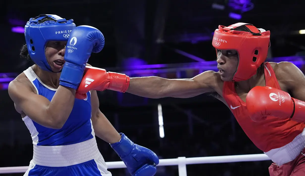 Pada Olimpiade Paris 2024, terdapat 37 atlet yang tergabung dalam kontingen ini. Ngamba lolos kualifikasi tinju dan kini memegang tiket ke semifinal. (AP Photo/Ariana Cubillos)