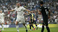 Striker Real Madrid, Gareth Bale, melakukan selebrasi setelah membobol gawang Leganes dalam laga lanjutan La Liga, di Santiago Bernabeu, Minggu (2/9/2018) dini hari WIB. (AP Photo/Andrea Comas)