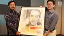 Sebuah lukisan bergambar Jokowi berhasil dilelang kepada Katadata dalam acara “Refleksi Kebebasan Pers dan Malam Penggalangan Dana” di Studio SCTV, Jakarta, Rabu (1/7). Lukisan tersebut dilelang dengan harga Rp 25 juta. (Liputan6.com/Immanuel Antonius)