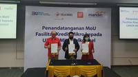 Direktur Utama Telkomsel Setyanto Hantoro, Wakil Direktur Utama Bank Mandiri Hery Gunardi dan  Direktur Utama LinkAja, Haryati Lawidjaja saat penandatanganan nota kesepahaman terkait penyaluran kredit usaha pada UMKM (Foto: Telkomsel)