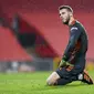 Kiper Manchester United (MU) David de Gea terpaku usai gawangnya dibobol pemain Sheffield United dalam lanjutan Liga Inggris di Old Trafford, Kamis (28/1/2021) dini hari WIB. (AP Photo/Laurence Griffiths,Pool)