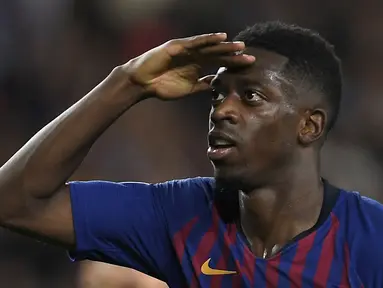 Ousmane Dembele merupakan pemain berkebangsaan Prancis yang direkrut Barcelona dari Borussia Dortmund pada bursa transfer musim panas 2017 dengan biaya 135 juta euro. Sayangnya, Dembele belum banyak memberikan kontribusi ke Blaugrana akibat sering mengalami cedera. (AFP/Lluis Gene)