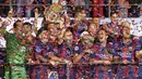 Para pemain Barcelona merayakan kemenangan mereka di laga final Liga Champions 2014-2015 di Olympiastadion, Berlin, Minggu (7/6/2015). Barcelona kandaskan Juventus dengan skor 3-1. (AFP Photo/Lluis Gene)