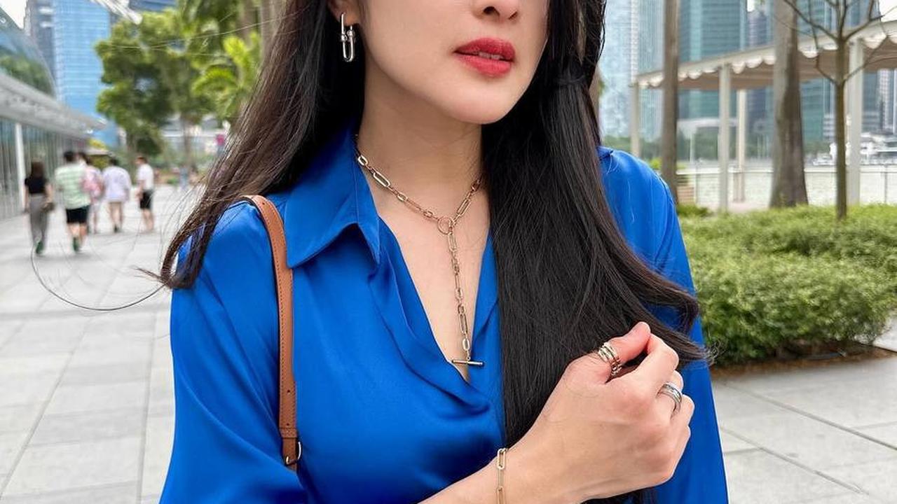Status Sandra Dewi