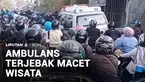 Tidak cuma Puncak, kawasan Lembang, Bandung Barat, juga selalu jadi langganan macet setiap momen liburan. Saking parahnya kemacetan, laju mobil ambulans pun terhalang.
