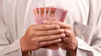 Ilustrasi uang rupiah, bansos. (Photo by Defrino Maasy)