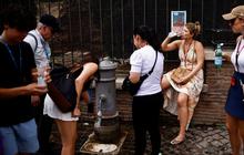 FOTO: Potret Gelombang Panas Eropa Menyiksa Turis-Turis di Roma Italia