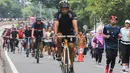 Sejumlah warga berolahraga saat Hari Bebas Kendaraan Bermotor (HBKB) di Bundaran Hotel Indonesia (HI), Jakarta, Minggu (29/12/2024). (Liputan6.com/Herman Zakharia)