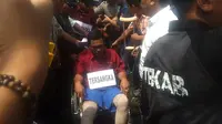 Rekonstruksi pembunuhan keluarga Medan diwarnai caci maki warga (Liputan6.com / Reza Efendi)