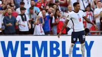 Jesse Lingard melakukan selebrasi ala Cristiano Ronaldo saat mencetak gol pertama Timnas Inggris ke gawang Andorra pada laga kelima Grup I kualifikasi Piala Dunia 2022 zona Eropa di Stadion Wembley, Minggu (5/9/2021) malam WIB. (AFP/Justin Tallis)