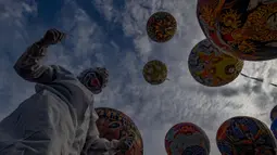 Festival yang menampilkan keindahan balon udara berwarna-warni ini merupakan bagian dari tradisi masyarakat Wonosobo yang telah berlangsung sejak puluhan tahun silam. (merdeka.com/Arie Basuki)
