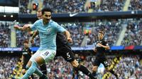 Ilkay Gundogan mengaku bahagia bersama Manchester City dan akan menghormati kontraknya yang tersisa dua tahun di Etihad Stadium. (AFP/Paul Ellis)