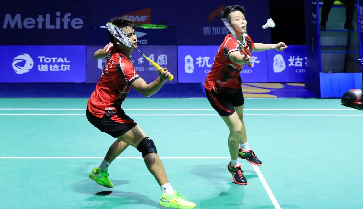 Ganda campuran Indonesia, Tontowi Ahmad/Liliyana Natsir, menyegel gelar juara China Terbuka Super Series Premier usai membungkam pasangan baru China, Zhang Nan/Li Yinhui. (PBSI)