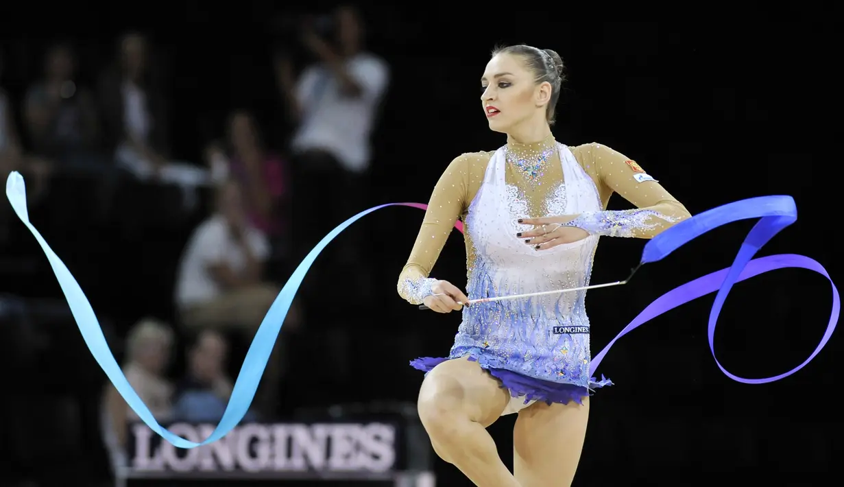 Evgenia Kanaeva menjadi andalan Rusia di nomor senam ritmik. Kanaeva adalah peraih emas Olimpiade 2008 dan 2012 serta emas Kejuaraan Dunia Senam Ritmik 2007, 2009, 2010, 2011. (AFP/Sylvain Thomas)