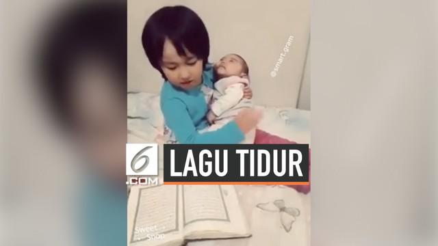 Beredar viral di media sosial, seorang bocah perempuan berhasil menidurkan bayi dengan lantunan ayat Al-Qur'an. Dan bayi tersebut langsung tertidur lelap.