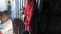 Salah satu potret pengungsi Rohingya di India (AFP/Dibyangshu Sarkar)