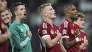 Para pemain Hungaria merayakan kemenangan atas Jerman dalam pertandingan sepak bola UEFA Nations League di Red Bull Arena di Leipzig, Jerman, Jumat, 23 September 2022. Hungaria menang atas Jerman 1-0. (AP Photo/Michael Sohn)