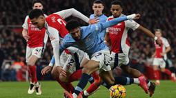 Bermain di hadapan pendukung sendiri, The Gunners menang telak 5-1 atas Manchester City. (Glyn KIRK/AFP)