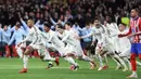 Real Madrid sukses mengalahkan Atletico Madrid lewat drama adu penalti dengan skor 1-0 (2-4) pada laga leg kedua 16 besar Liga Champions 2024/2025. (Thomas COEX/AFP)