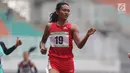 Atlet asal Bali, Dewi Ayu Agung Kurnia saat menyelesaikan lomba lari 400 meter putri senior Kejurnas Atletik U18, U20 dan Senior 2019 di Stadion Pakansari, Kab Bogor, Jumat (2/8/2019). Dewi Ayu Agung Kurnia meraih posisi pertama dengan catatan waktu 55,56 detik. (Liputan6.com/Helmi Fithriansyah)