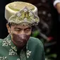 Presiden Joko Widodo mengenakan pakaian adat Baju Paksian asal Provinsi Bangka Belitung saat menghadiri Sidang Tahunan MPR dan Sidang Bersama DPR - DPD Tahun 2022 di Gedung Nusantara, Kompleks Parlemen, Senayan, Jakarta, Selasa (16/8/2022). Jokowi menyampaikan pidato kenegaraan dalam sidang tahunan MPR RI dan sidang bersama DPR RI dan DPD RI Tahun 2022. (Liputan6.com/Johan Tallo)