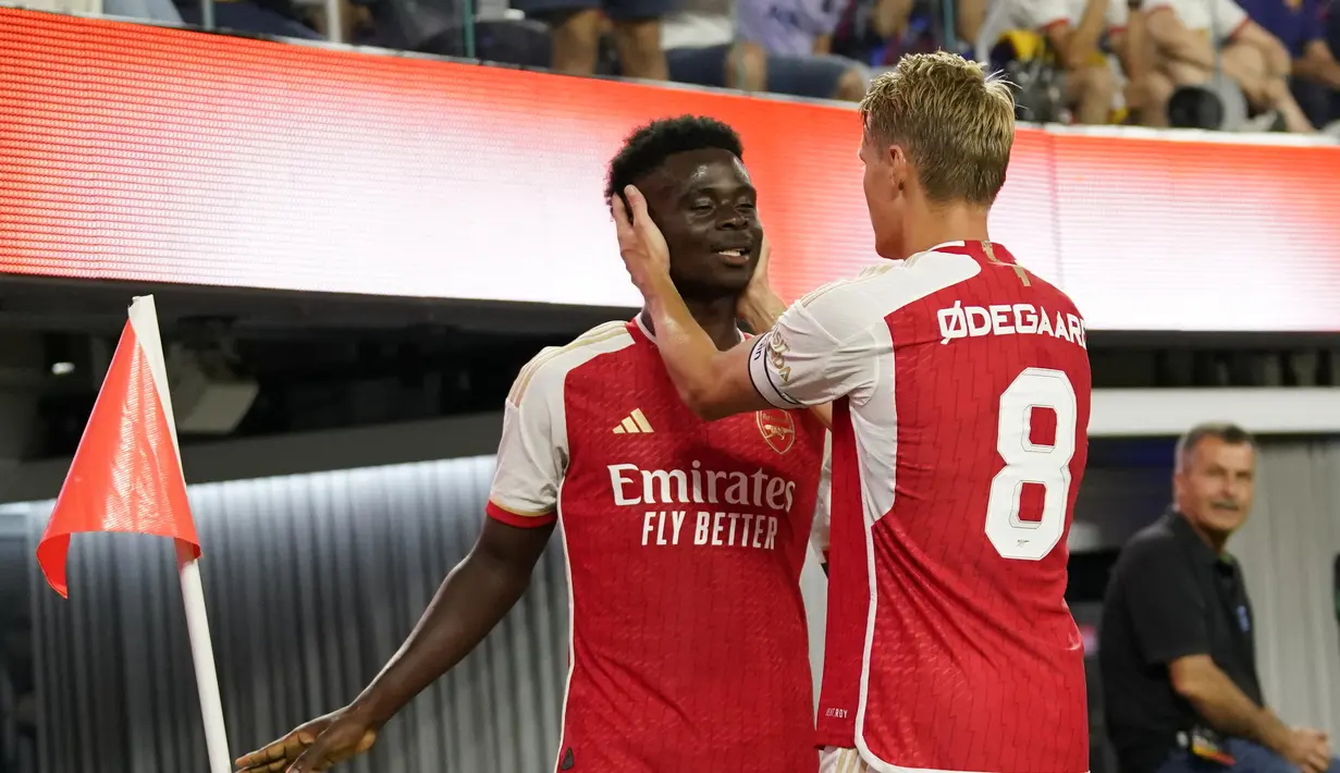 <p>Arsenal menang atas Barcelona dengan skor 5-3. (AP Photo/Ashley Landis)</p>