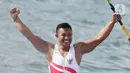 Atlet kano Indonesia, Maizir Ryondra, melakukan selebrasi usai tampil pada nomor Men's K1 1000 meter SEA Games 2019 di Subic Bay, Filipina, Jumat (6/12/2019). Maizir berhasil meraih medali emas dengan catatan waktu 3 menit 55,841 detik. (Bola.com/M Iqbal Ichsan)