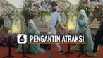 Aksi hebat ditunjukkan oleh seorang mempelai wanita saat resepsi pernikahan.