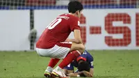Berakhirnya laga dramatis leg kedua semifinal Piala AFF 2020 antara Indonesia menghadapi Singapura (25/12/2021) yang meloloskan Indonesia ke babak final untuk keenam kalinya disambut dua ekspresi suka dan duka dari kedua kubu. Seperti apa ekspresinya? (AP/Suhaimi Abdullah)