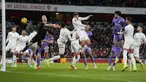 Bek Arsenal Jakub Kiwior (tengah atas) memukul bola untuk mencetak gol bunuh diri ke gawang Liverpool pada babak ketiga Piala FA 2023-2024 di Emirates Stadium, Minggu (07/01/2024) malam WIB. (AP Photo/Kirsty Wigglesworth)