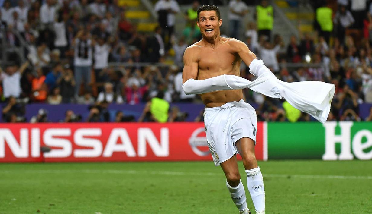 Bintang Real Madrid, Cristiano Ronaldo, merayakan gol penentu kemenangan atas Atletico Madrid pada final Liga Champions.  Pria Portugal ini sukses membawa El Real mencapai La Decima atau gelar ke-10 pada Liga Champions. (AFP/Gerard Julien)