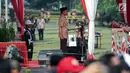 Presiden Joko Widodo memberikan pengarahan dalam acara Peringatan Hari Pramuka dan Pembukaan Raimuna Nasional XI Gerakan Pramuka di Bumi Perkemahan Cibubur, Jakarta, Senin (13/8). (Liputan6.com/Faizal Fanani)