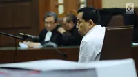 Terdakwa korupsi proyek E-KTP Setya Novanto saat mengikuti sidang perdana di Pengadilan Tipikor, Jakarta, Rabu (13/12). Sidang mendengarkan pembacaan dakwaan oleh JPU KPK. (Liputan6.com/Helmi Fithriansyah)