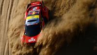Pembalap Prancis, Sebastien Loeb dan co-driver Fabian Lurquin dari Belgia bersaing selama Stage 1A Reli Dakar 2022 antara Jeddah dan Hail, di Arab Saudi, pada 1 Januari 2022.
(AFP/Franck Fife)