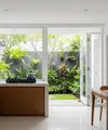 Dapur Terbuka Minimalis Anti Cipratan Minyak yang Dinding Terjaga Kebersihannya Model Menyatu dengan Taman Belakang (Image generated by AI)