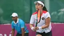 <p>Petenis tunggal putri Indonesia, Aldila Sutjiadi saat tampil menghadapi Thailand pada laga final nomor beregu putri cabor tenis SEA Games 2023 di Morodok Techo Stadium, Phnom Penh, Kamboja, Selasa (9/5/2023). (Bola.com/Abdul Aziz)</p>