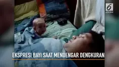 Menggemaskan, begini ekspresi kaget seorang bayi saat mendengar ayahnya mendengkur keras.
