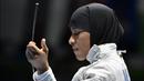 Keberhasilan tersebut membuat Ibtihaj menjadi atlet wanita muslim-Amerika pertama yang mendapatkan medali di Olimpiade. Setelah kiprah apiknya tersebut, ia menjadi salah satu simbol terbaik melawan intoleransi yang dimiliki Amerika. (Foto: AFP/Fabrice Coffrini)