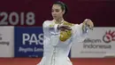 Atlet wushu Indonesia, Lindswell, saat beraksi pada Asian Games di JIExpo, Jakarta, Minggu, (19/8/2018). Sukses mengumpulkan poin tertinggi, atlet cantik ini berpeluang meraih emas dari nomor Taijiquan dan Taijijian. (Bola.com/Vitalis Yogi Trisna)