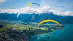 Puluhan paraglider melakukan penerbangan menuju pendaratan "Acro Show" di atas Danau Jenewa di Villeneuve, Swiss (20/8). Olahraga paragliding ini untuk tujuan rekreasi atau kompetisi. (Valentin Flauraud / Keystone via AP)