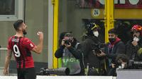 Pemain AC Milan Olivier Giroud melakukan selebrasi usai mencetak gol ke gawang Lazio pada pertandingan perempat final Coppa Italia di Stadion San Siro, Milan, Italia, 9 Februari 2022. AC Milan menang 4-0. (AP Photo/Antonio Calanni)