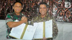 Penandatangan perjanjian nota kesepahaman antara Unit Usaha Syariah (UUS) Bank BTN atau BTN Syariah dengan Akademi Militer (Akmil) merupakan komitmen BTN Syariah untuk memberikan pelayanan terbaik bagi anggota Akmil melalui produk dan program unggulan. (Liputan6.com/HO/BTN)