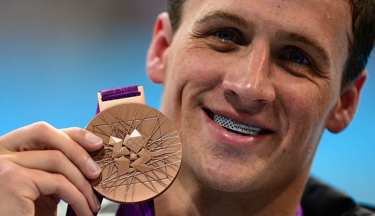 Pada London 2012, Ryan Lochte kembali memberikan AS dua medali emas. Keduanya diraih Lochte dari nomor 400m gaya ganti dan 4x200m gaya bebas. (AFP/Martin Bureau)