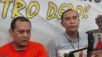 Tersangka Rizky Noviyandi Achmad (kiri) saat menjelaskan terkait penganiayaan yang dilakukan kepada istri dan anaknya di Polres Metro Depok. (Liputan6.com/Dicky Agung Prihanto)