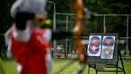 Pemanah dari tim provinsi Aceh menghadiri sesi latihan di sebuah stadion di Banda Aceh (2/9/2020). (AFP Photo/Chaideer Mahyuddin)