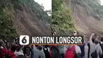 Mereka dengan santai dan asyiknya merekam tanah longsor dengan ponsel.