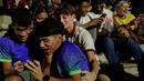 Hal itu membuat warga Brasil tak mampu menyembunyikan rasa senangnya. (AP Photo/Bruna Prado)