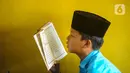 Tadarus juga bisa diartikan belajar. Kata belajar ini dalam konteks luas seperti membaca, memahami serta mengkaji secara bersama-sama kitab suci Al Quran. (merdeka.com/Arie Basuki)