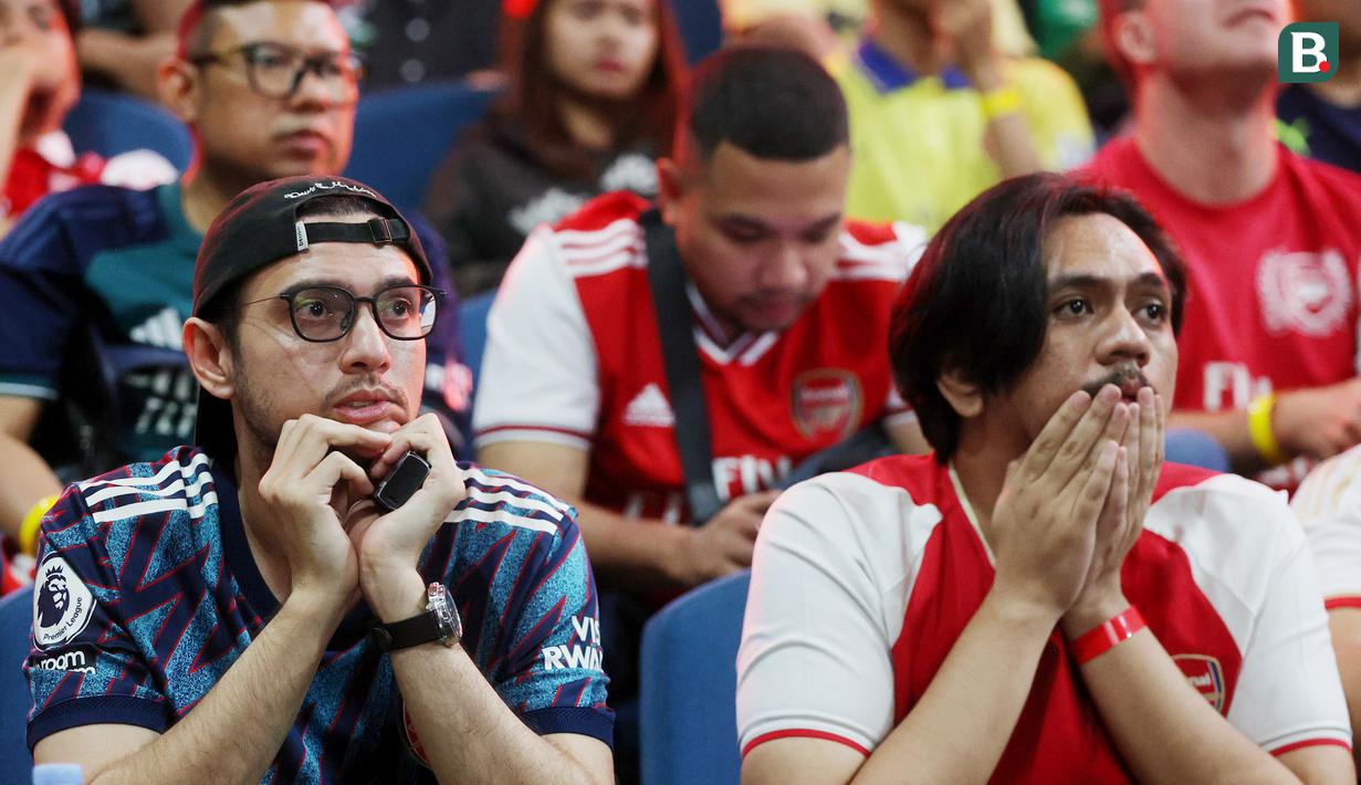Fans tampak kecewa saat acara Roaring Night Arsenal vs Everton di Bulungan Theatre Building, Jakarta, Minggu (19/5/2024). (Bola.com/M Iqbal Ichsan)